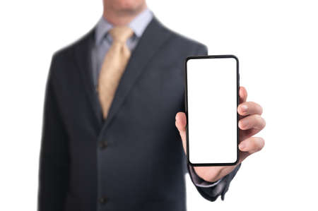 businessman showing phone. Businessman shows cell phone with blank screen. Man hold smart mobile...