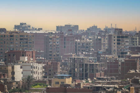 arab city, chaotic development. View Over Smoggy Slums Of Cairo. look over Cairo with its traditional egyptian buildings as seen from the Giza Plateauの写真素材