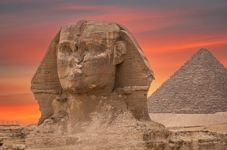 Great Pyramid Of Pharaoh Khufu, Located At Giza And The Sphinx. Egypt. the face of the Sphinx and...