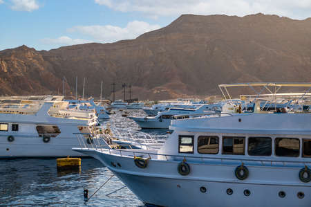 Sharm el Sheikh, EGYPT - MAY 18 2021: yacht port of the resort town on the red sea. against the backdrop of the Sinai mountainsのeditorial素材
