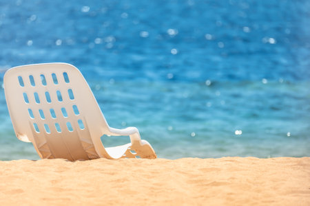 Beach Chair On Idyllic Tropical Sand Beach. Beach chair on sandy beach and turquoise sea. Summer vacation and travel concept. vacation offer. copy spaceの写真素材