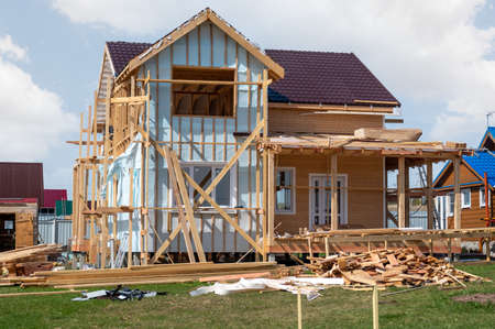 Residential country house under construction. construction of a cottage in the final stage. Building...