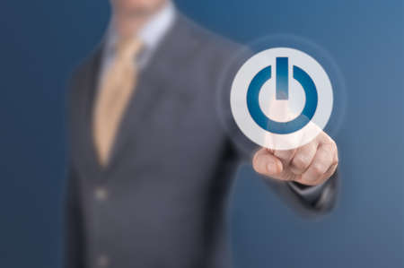 man press start. Businessman pressing power button concept. start up business concept. business, technology, internet and networking conceptの写真素材