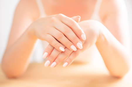middle aged Female Palm. Beautiful Glamor Manicure. Care about Hands and Nails, clean Skin. Professional manicure in beauty salon. Hygiene and care for hands. Beauty industry concept.の写真素材