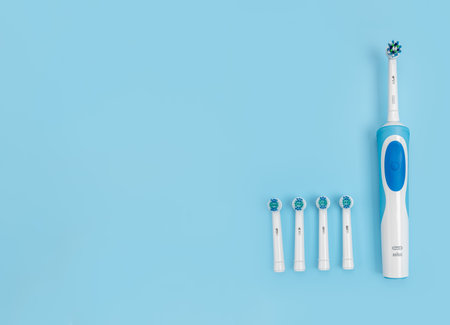 Russia, Moscow, july 22, 2021: Braun Oral-B toothbrush head Cross Action. Modern rechargeable sonic or electric toothbrush. Concept of professional oral care and healthy teeth. copy spaceのeditorial素材
