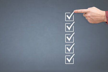 hand ticking checkboxes with marker pen on checklist or to-do list with copy space. gray background. Hands check all the check box. to do list mockup. Check list mockup and man handの写真素材