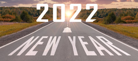 New Year road trip travel and future vision concept . Nature landscape with highway road leading forward to happy new year celebration in beginning of 2022. successful start new yearの写真素材