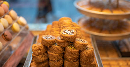 oriental sweets, baklava. Sweet food, dry fruit, baklava and oriental pastry roll in bazaar at historical centre of Istanbul, Turkey. Oriental Arabic Turkish Sweets and dessertの写真素材