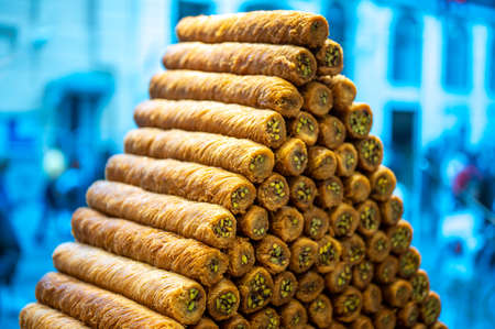 traditional oriental sweets baklava with nuts. Juicy sweetness, Honey baklava. Traditional oriental dessert. Pieces of sweet puff pastry with walnuts. Food background. Soft focus. Close up shotの写真素材