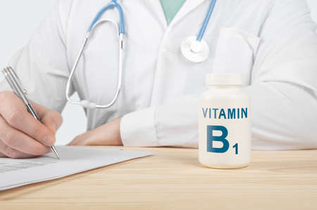Vitamins and supplements for human health. Doctor recommends taking vitamin B1. doctor talks about Benefits of vitamin B1. Essential vitamins and minerals for humans. B1 Vitamin Health Concept.の写真素材