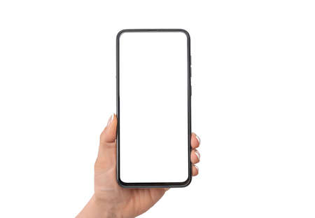 Woman hand holding black cell phone smartphone with blank white screen and modern frame less design,...