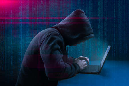 hack attack. Dangerous Hooded Hacker Breaks into Government Data Servers. Cybersecurity, computer...