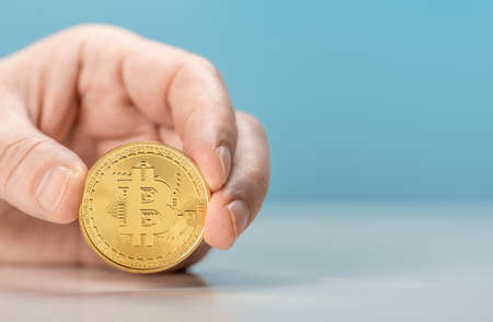 Hand hold Golden bitcoin Investment market trend financial world cryptocurrency and technology....