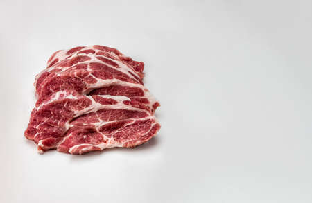 Fresh pork steaks. front view. Slices pork loin on gray background. raw pork marbled steaks. raw...
