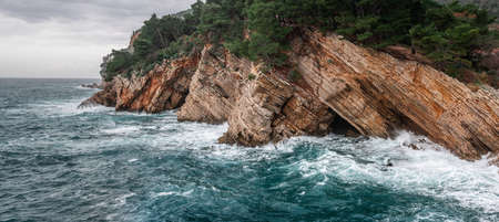 Picturesque winter view to the Adriatic sea coast near Petrovac, Montenegro. Cloudy weather over the Adriatic coastの写真素材