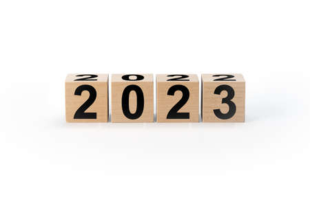 Wooden Blocks With 2022 2023 Number isolated on white background. Start new year 2023 with goal...