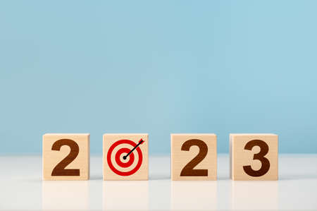 2023 Goal, Plan, Action alphabet letter on wooden cubes. Concept new year 2023 resolution and future...