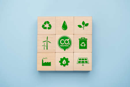 Net Zero and Carbon Neutral Concepts, Net zero and carbon neutral concept. Net zero greenhouse gas emissions target. wooden cube with green net center icon and green iconの写真素材