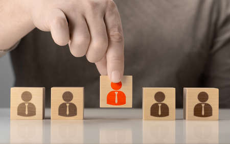 HR, Human resources and team completing. Human resources and personnel hiring concept. Employees are represented by wooden cubes with icons. Business with Recruitment, Hiring, Team Building.の写真素材