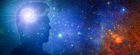 Silhouette of a man's head with aura chakras on space. Beyond the Mind. Silhouette of man with space...
