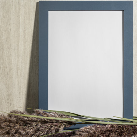 Frame mock up and dried natural pampas grass. interior decoration element. Flat lay top view....