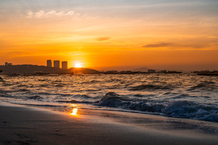 Pattaya Beach in sunset, evening. Sunset landscape. Pattaya City and Sea with sunset, Thailand. Pattayaの写真素材