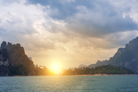 Incredible sunset Khao Sok National Park, Thailand. Cheow Lan lake Famous attraction adventure place travel Thailand. Asia holiday tripの写真素材