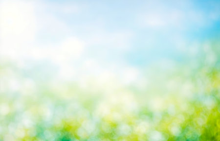Summer background of blue and green, blurred foilage and sky with bright bokeh. Blurry abstract summer background. Natural leaves green using as cover page greenery environment ecology backgroundの写真素材