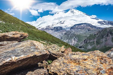 Panorama mountain summer landscape. summer mountain landscape. Beautiful landscape with high mountains, blue sky with white clouds. Amazing scene with mountainsの写真素材