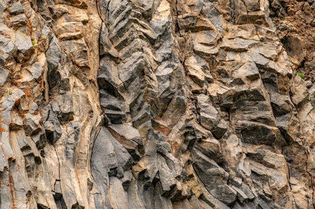 natural rock background texture. Basalt columns, rock formation, unusual mountain topography,...