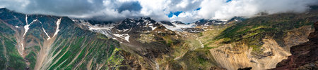 Panorama mountain summer landscape. summer mountain landscape. Beautiful landscape with high mountains, blue sky with white clouds. Amazing scene with mountainsの写真素材