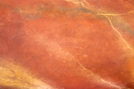 stone texture. Luxurious, polished red and orange stone texture. Sleek, glossy appearance enhances...
