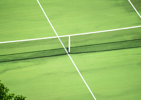 tennis court background. Detailed shot of tennis court from above, emphasizing net. closeup showcases court texture, with special focus on net structure, tennis competitionの写真素材