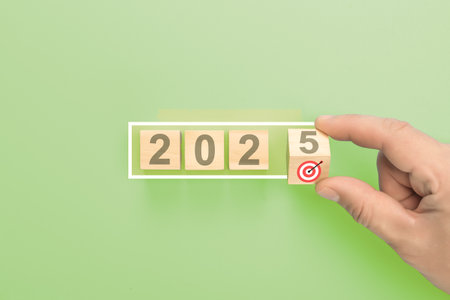 Starting new year 2025. Flipping wooden cube blocks. Inspiration to success ideas and goals....