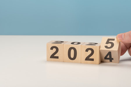 2025 happy new year, Flipping of wooden cube block change from 2024 to 2025. Wooden cube with flip...