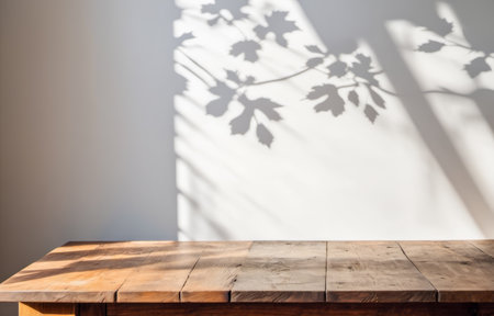 Product placement. wooden table and wall with tree shadow pattern, aesthetic contrast, items...