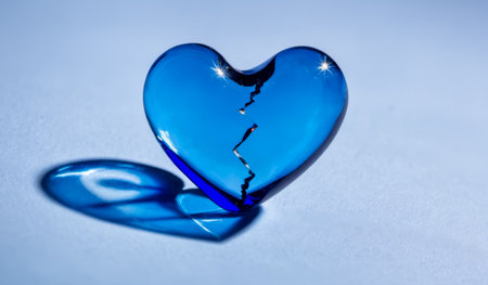 Deep Blue Glass Heart, Shattered into Pieces, Illustrating Emotional Crisis, Betrayal, Heartbreak, Loveless State, Jagged Edges Indicating Forceful Break, Shiny Surfacesの素材
