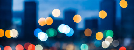 Abstract background of vibrant bokeh lights against blurred city, atmospheric night scene with defocused urban skyline, decorative colorful light orbs, lively metropolitan ambiance illustrationの素材