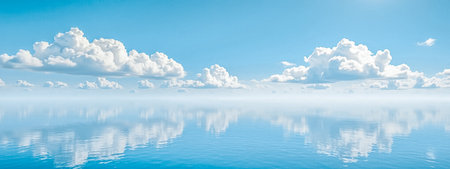 Serene water reflecting fluffy clouds, blue sky mirror image, calm lake surface, peaceful nature...