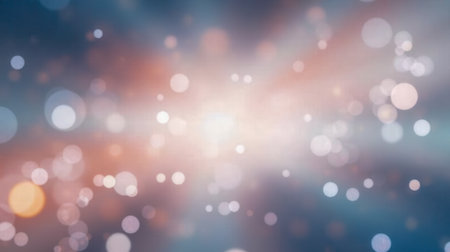 Gentle bokeh lights in abstract blurred background with soft gradients of warm pink and cool blue...