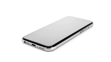 Modern cellphone lying on white surface detailed view sleek mobile device showing side buttons charging port speaker holes isolated technology communication gadget portable touchscreenの写真素材