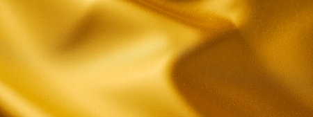 Shiny golden fabric background with smooth surface, elegant folds, luxury textile texture, metallic...
