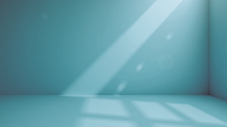Bright blue interior with sunlight through window, soft shadows, spacious minimal design, background for text placement or creative project visualの写真素材