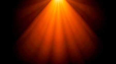 Bright glowing light beam isolated on dark background, suitable for overlays, photography, videography, graphic designs, mood enhancementの写真素材