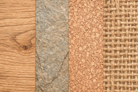 Stylized arrangement of raw surfaces including timber grains, rough stone finish, cork texture and rustic jute cloth useful for product or eco design templatesの写真素材