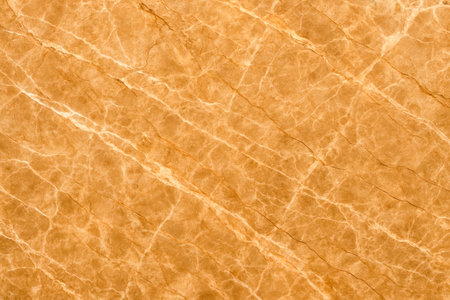 Luxurious stone texture featuring warm amber tones and delicate white streaks creating elegant backdrop for high end branding projects wall coverings flooring presentationsの写真素材