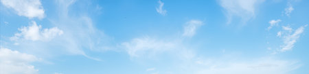 Wide blue sky with cirrus clouds, clear sunlight, tranquil natural background, clean air, calm mood, ideal for design, web, advertising, open spaceの写真素材