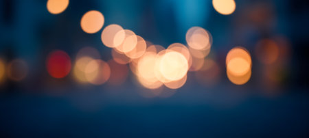 Urban glowing light orbs softly diffused across night scene in elegant warm golden tones offering dreamy layout for visual backgroundの写真素材