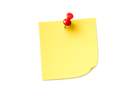 Minimalist office supply sticky note with vibrant red push pin for important reminders, brainstorming ideas, business planning, organizational tasks, workspace notesの写真素材