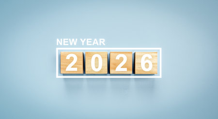 Minimalist greeting card for 2026 new year. Wood cubes with date inside white border for festive...